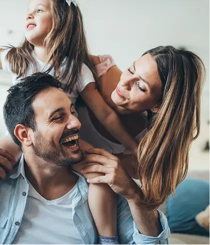 Image of a family (Husband, wife, and daughter)