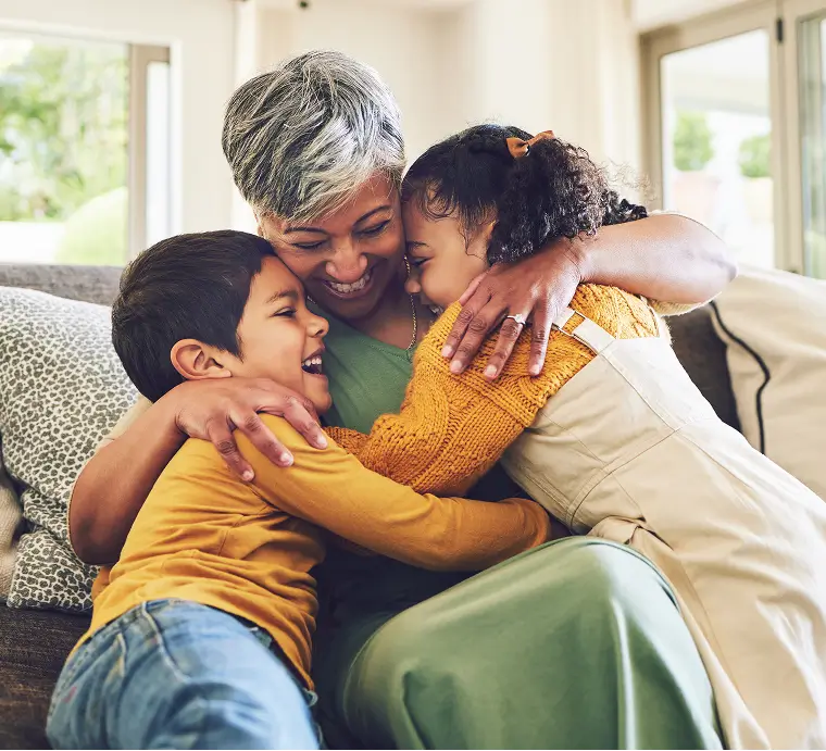 Grandma with her grandkids hugging
