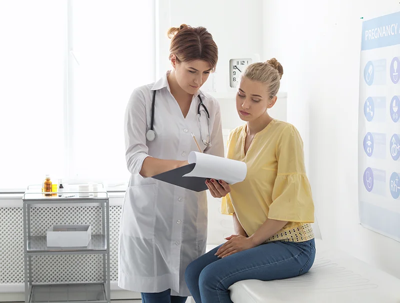 A young woman consults with her doctor